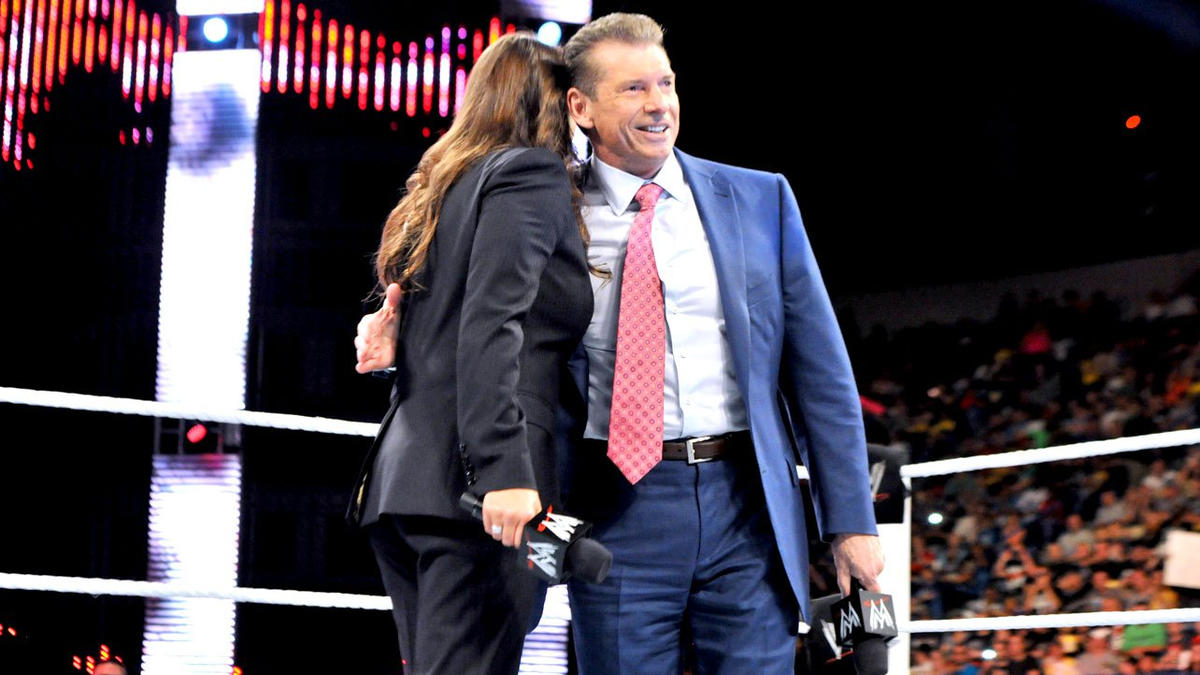 Stephanie McMahon and Vince McMahon hug on WWE Raw 2013