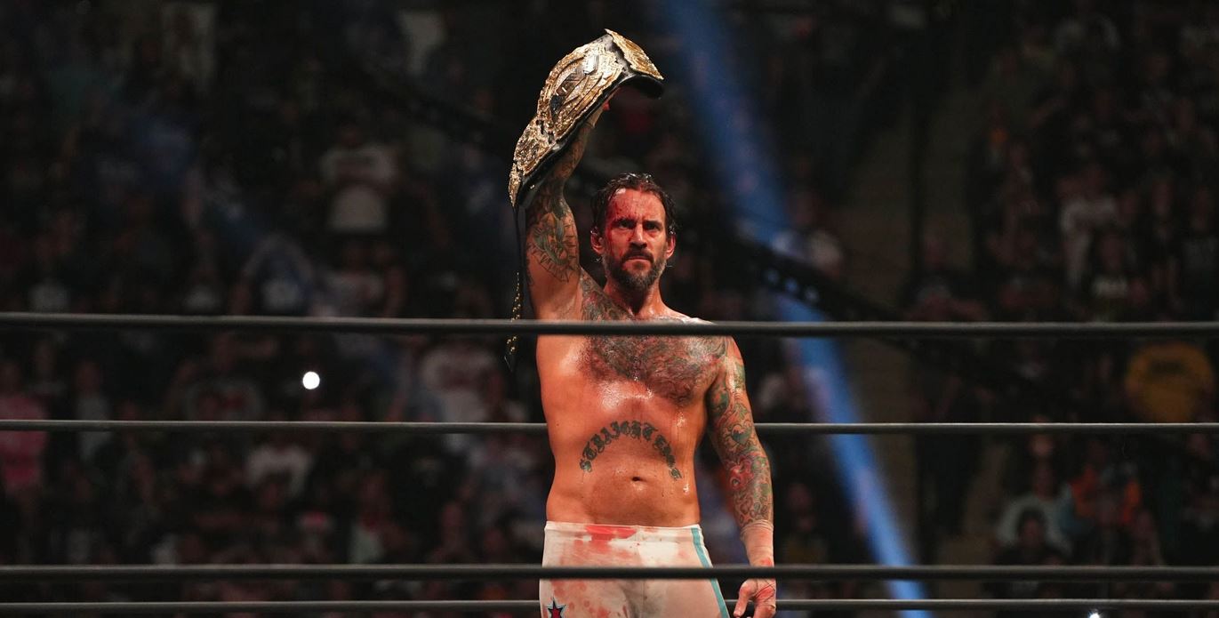 CM Punk with the AEW World Championship