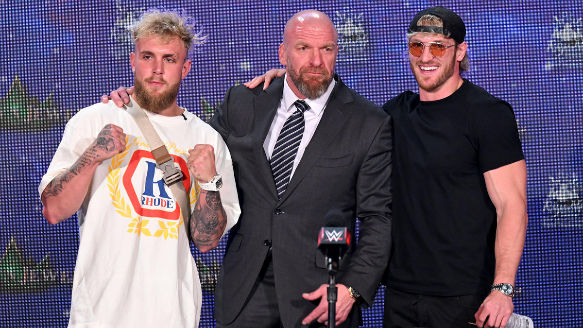 Triple H poses with Logan Paul Jake Paul at WWE Crown Jewel 2022 press conference
