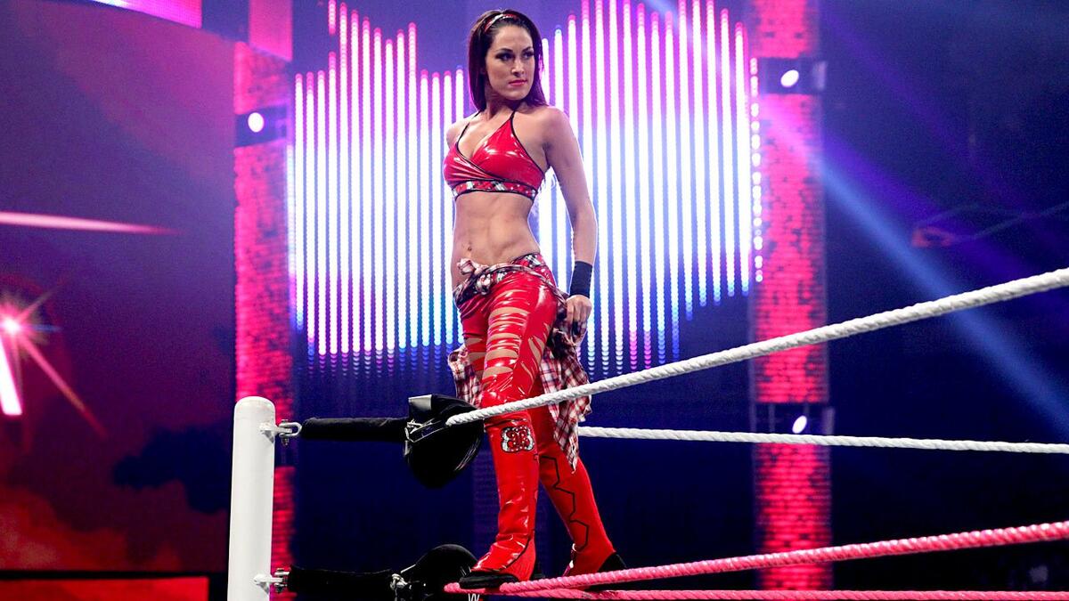 Brie Bella standing on turnbuckle