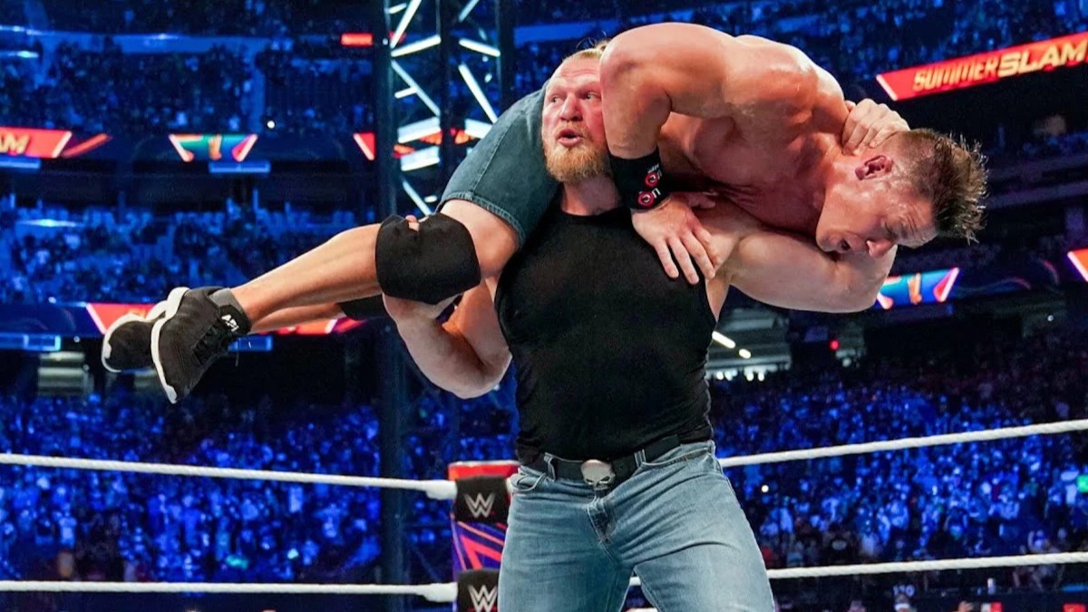 Brock Lesnar with John Cena on his shoulders at WWE SummerSlam 2025