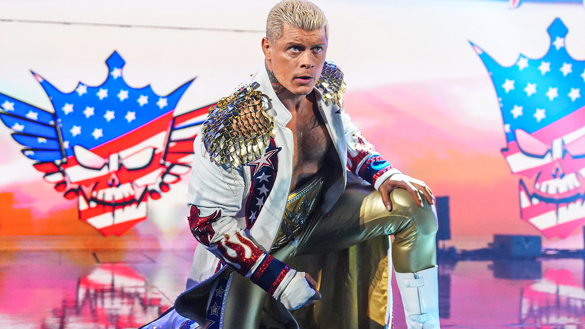 Cody Rhodes kneeling on stage on WWE SmackDown