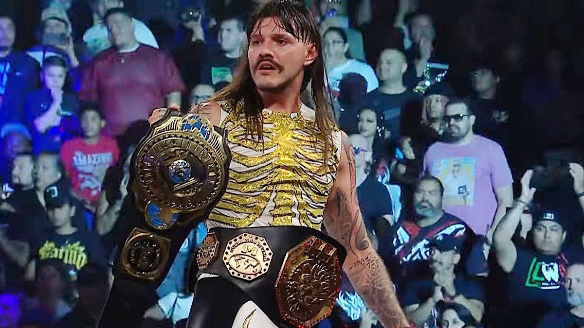 Dominik Mysterio holding up AAA Mega Championship